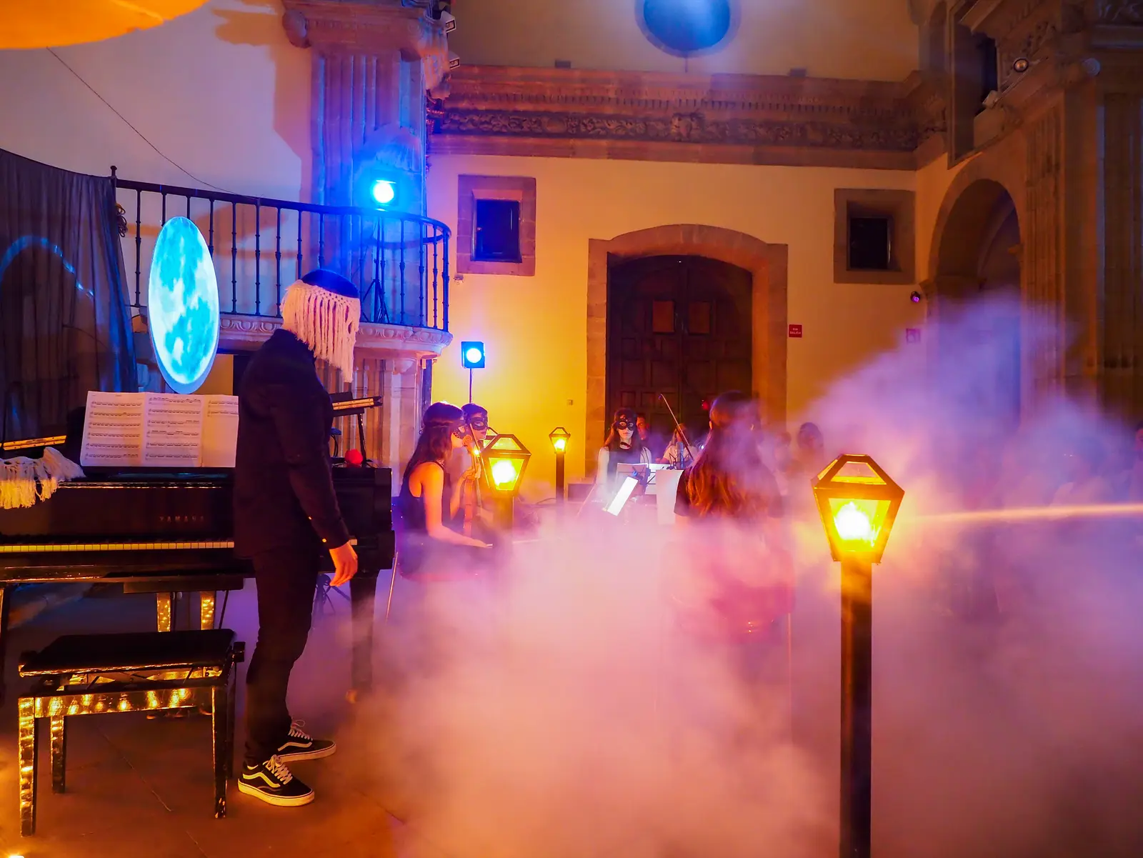The stage in mist and blue light during the concert
