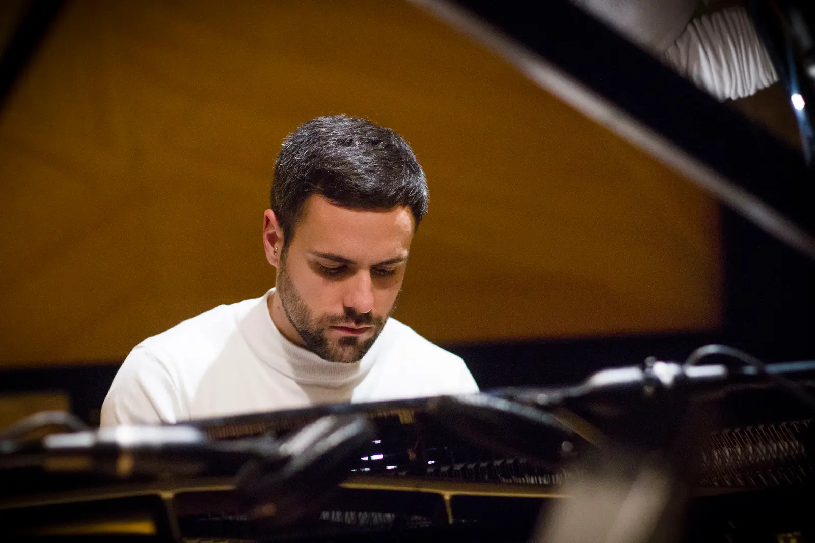 David Catá, focused, at the piano